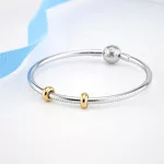 Ezüst charm stopper 2 db + törlőkendő, aranyszín