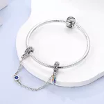 Ezüst charm biztonsági lánccal, madártoll