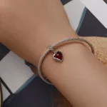 Ezüst charm, szárnyas szív