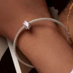 Ezüst charm, csipke
