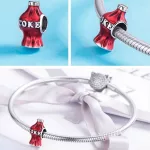 Ezüst charm, kólásüveg