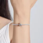 Ezüst charm, aranyhal
