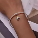 Ezüst charm, görkorcsolya