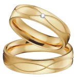 Női karikagyűrű hullámmintával, titánacél, aranyszínű, 10