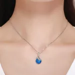 Ezüst repülőgép földgömbbel charm 