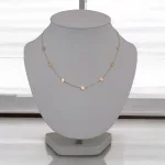 14k arany nyaklánc, 7 db tallér medállal