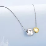 Ezüst nyaklánc aranyozott medállal