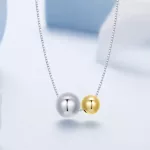 Ezüst nyaklánc aranyozott medállal