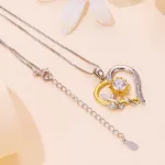 Ezüst női nyaklánc virágos szívmedállal