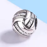 Ezüst charm, csomó
